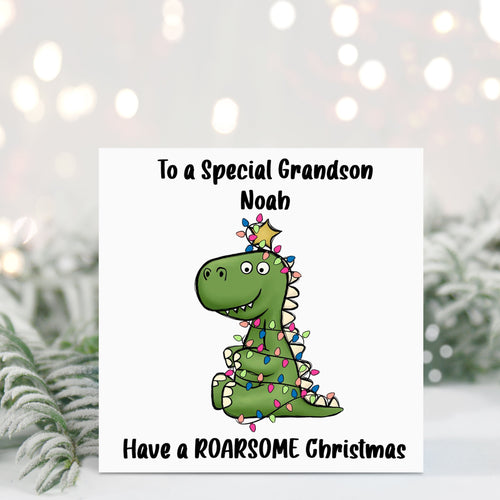 Christmas card with a dinosaur illustration and personalized text in front of a snowy background.