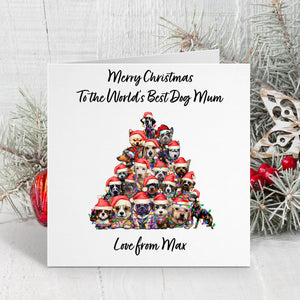 Christmas card with a dog-themed tree design and festive text on a white background.