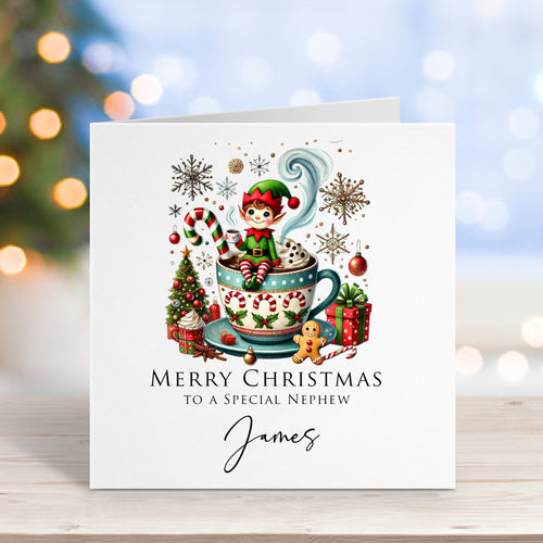 Christmas card with elf design on a wooden surface with blurred lights in the background