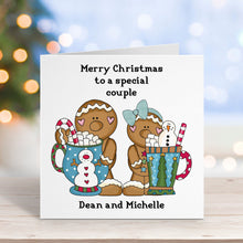 Christmas card with gingerbread people and personalized text on a blurred festive background