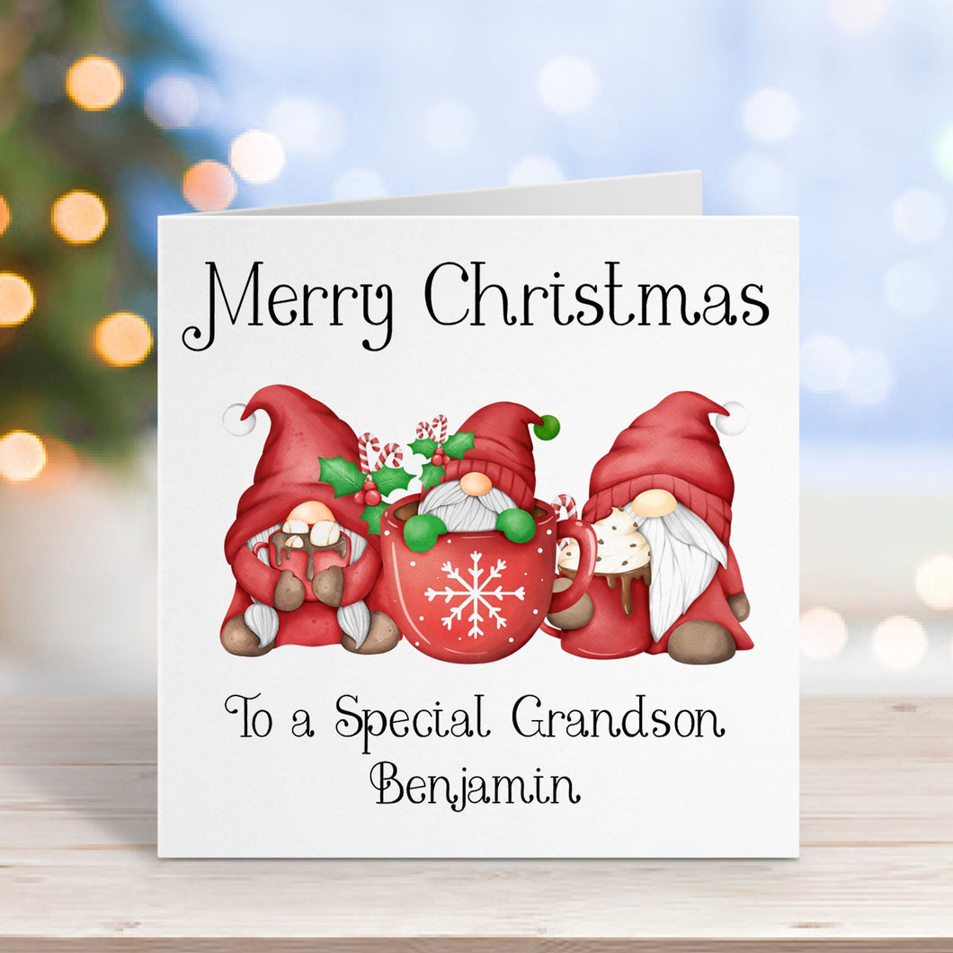 Christmas card with gnomes on a wooden surface with blurred lights in the background