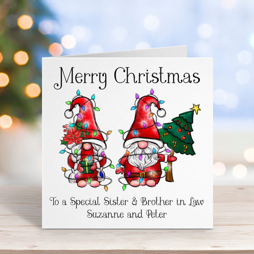 Christmas card with two gnomes and personalized text on a blurred Christmas tree background