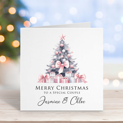 Christmas card with a tree and presents on a blurred festive background
