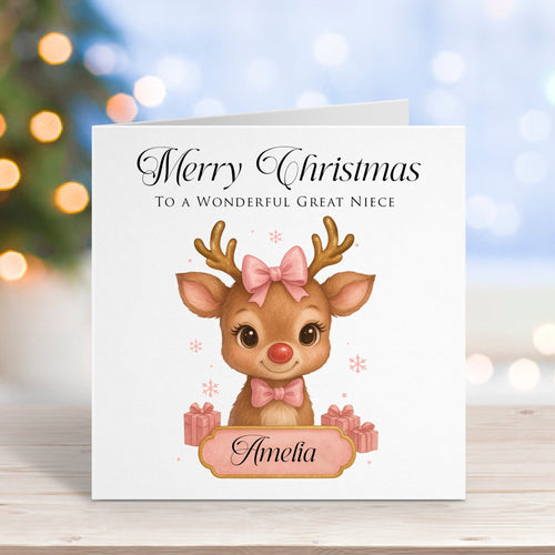 Christmas card with a reindeer illustration and personalized text on a wooden surface with blurred lights in the background.