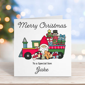 Christmas card with a gnome on a train, surrounded by presents, on a blurred festive background.