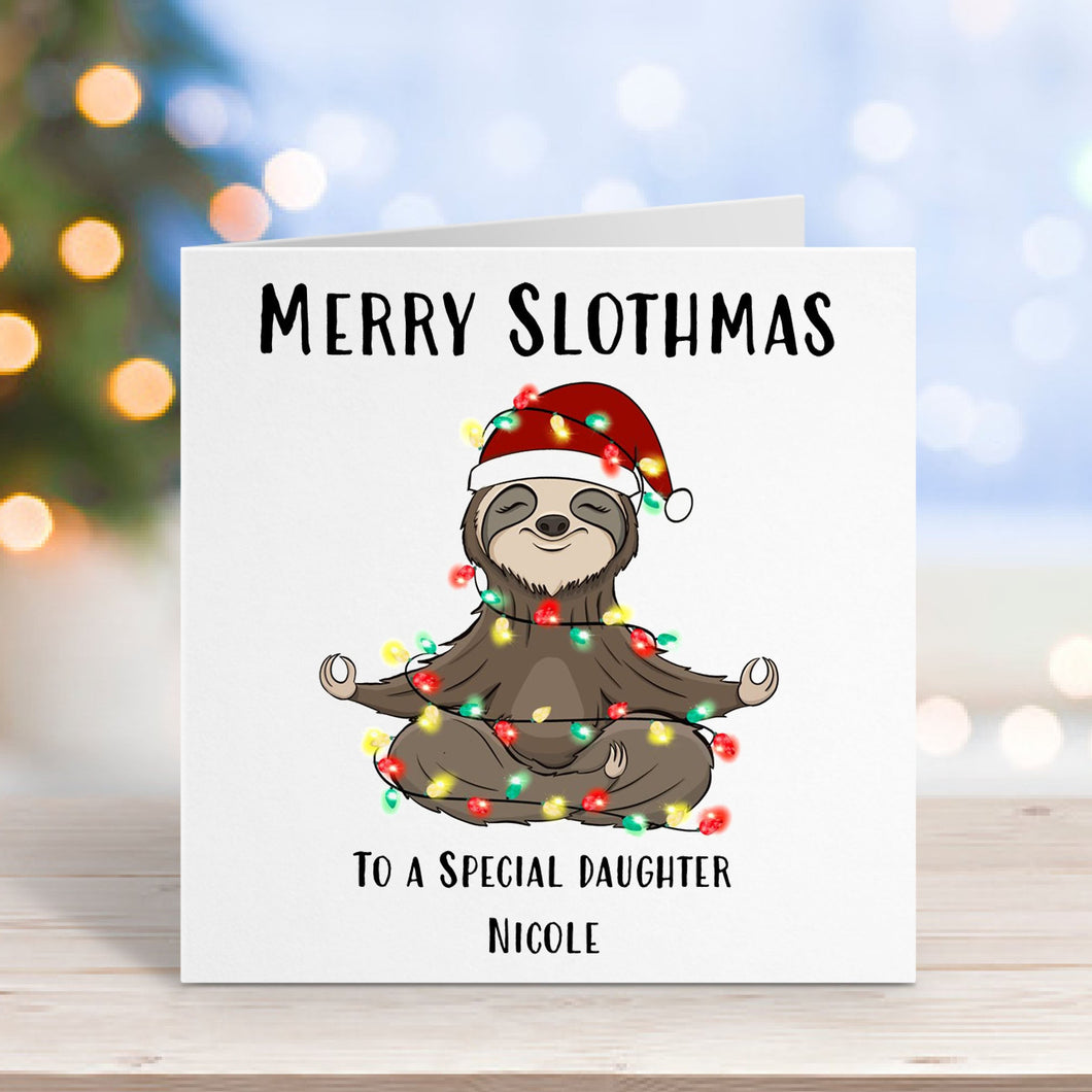 Greeting card with a sloth wearing a Santa hat and Christmas lights, text 'Merry Slothmas to a special daughter Nicole' on a blurred festive background.