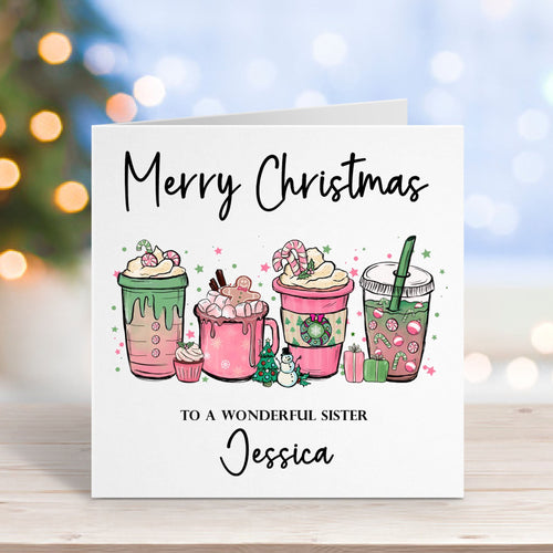 Christmas card with illustrations of hot drinks and personalized text on a blurred background