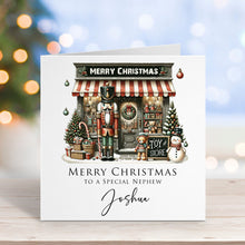 Christmas card with toy store illustration and personalized text on a blurred festive background