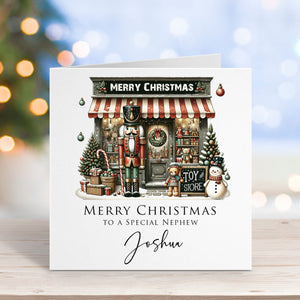 Christmas card with toy store illustration and personalized text on a blurred festive background