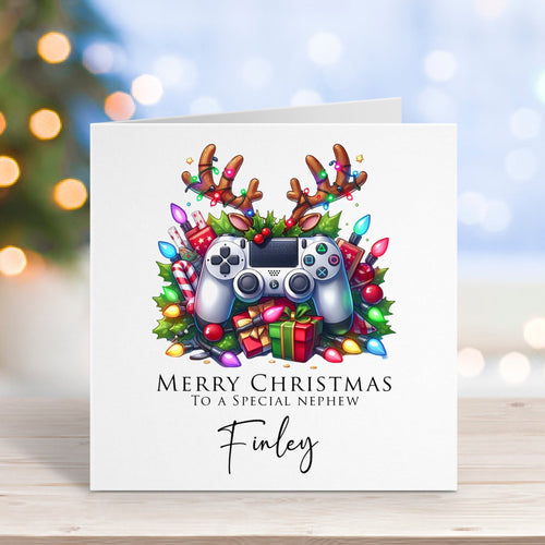 Christmas card with a gaming controller and festive design on a blurred background