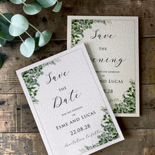 Esme Save the Date and Save the Evening cards with sage eucalyptus foliage in opposite corners, a fine grey border and flowing black script