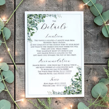 Esme sage eucalyptus wedding information card with location, accommodation and taxi details, displayed on rustic wood with greenery and fairy lights.