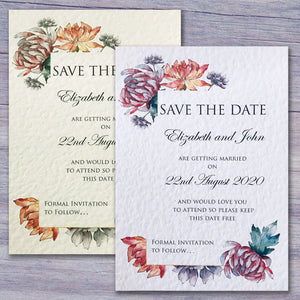 Alexia Save the Date cards in white and ivory on a grey wooden table