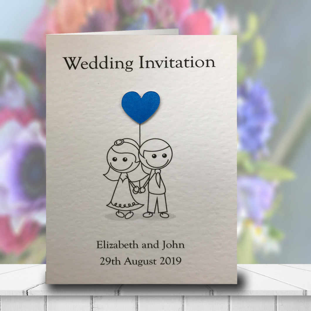 Folded Amelia wedding invitation in white with a blue heart