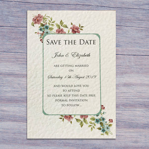 CATHERINE Save the Date cards in Ivory on a blue wooden table